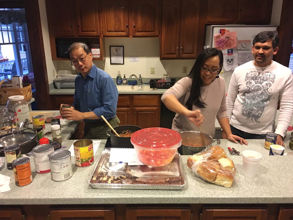 APIC members cooking at David's House