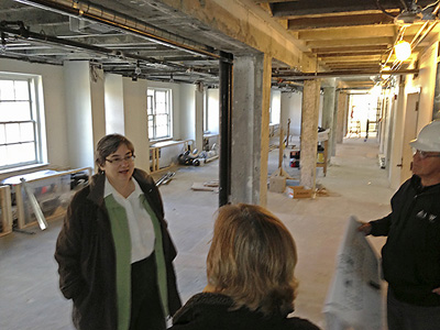 Peggy Sleeth and Susan Jorgensen in the north end of what will be the open study space with tables, chairs and couches.  This end also has 2 small class/meeting rooms.  The other end has an 18 seat classroom.