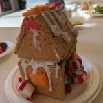 A gingerbread house with an orange starburst window.
