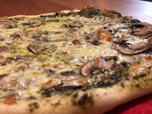 homemade pizza with mushroom and cheese.