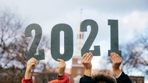 Picture of students holding up a class of 2021 sign