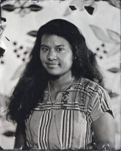 Kali Spitzer (Kaska Dena / Jewish), Nicole Gilbert, Naturalized Citizen of the United States, born Guatemala, 2020, tintype. Hood Museum of Art, Dartmouth College: Gift of Nicole S. Williams, Class of 2017F M.A.L.S.; 2020.15. Nicole is wearing a dress from Guatemala in this photograph.