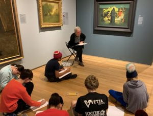 Docent Ellie Ringers leads a creative writing exercise with Frederic Remington’s Shotgun Hospitality.