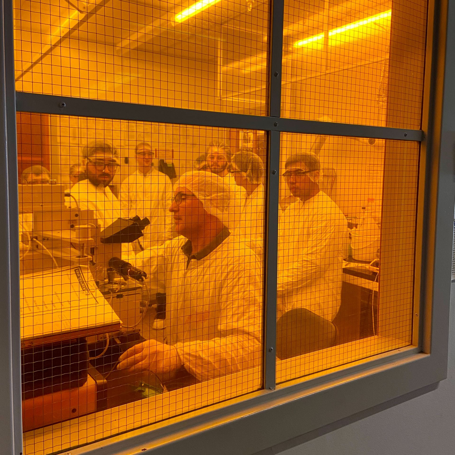 Phil Chapman gives students a photolithography demonstration as part of a tour of the MicroEngineering Cleanroom.