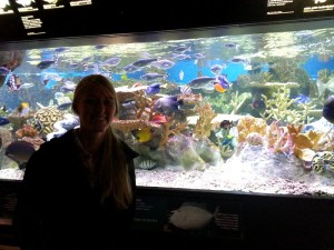 Leigh in front of one of the coral reef tanks at the aquarium.